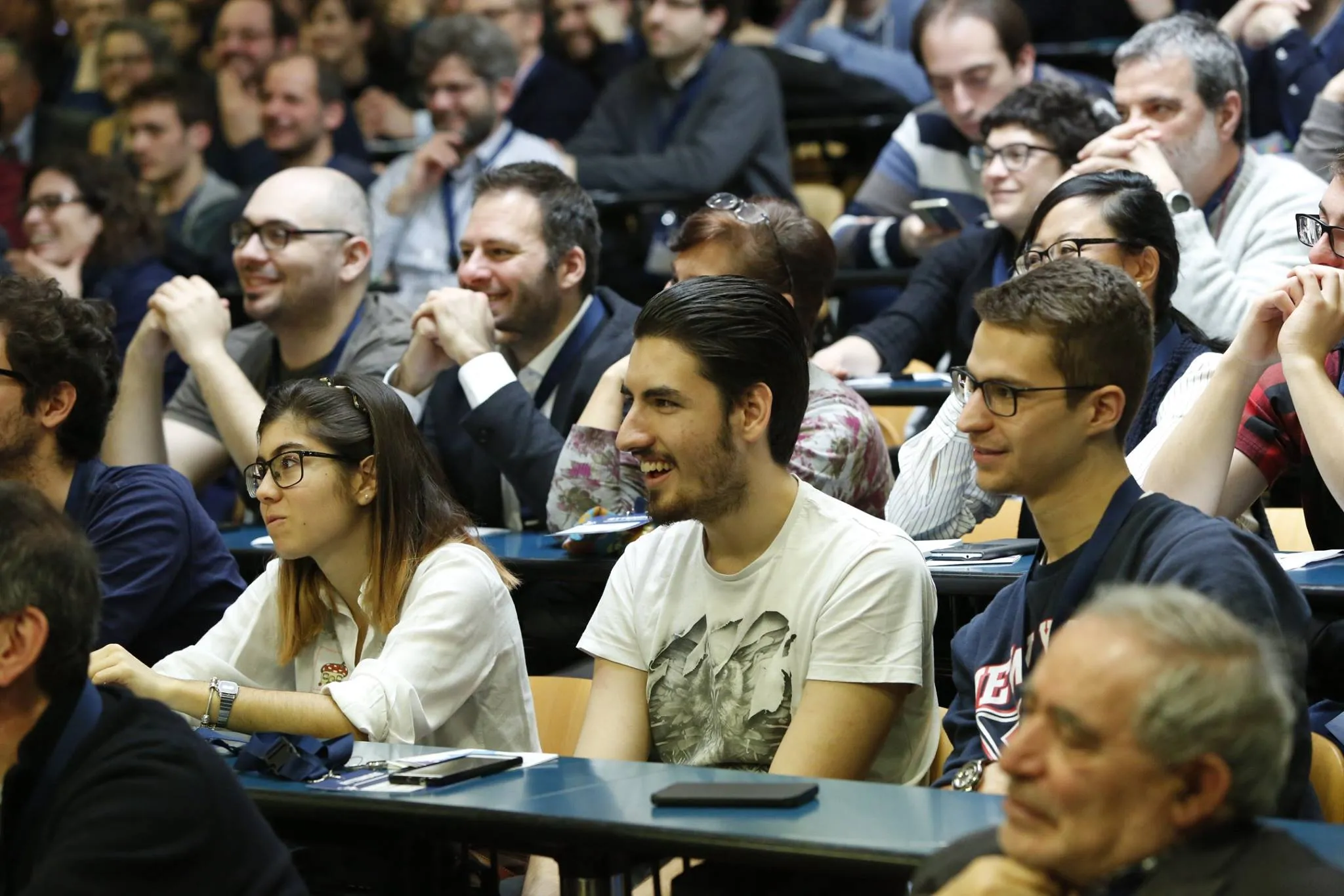 An audience laughing during a talk