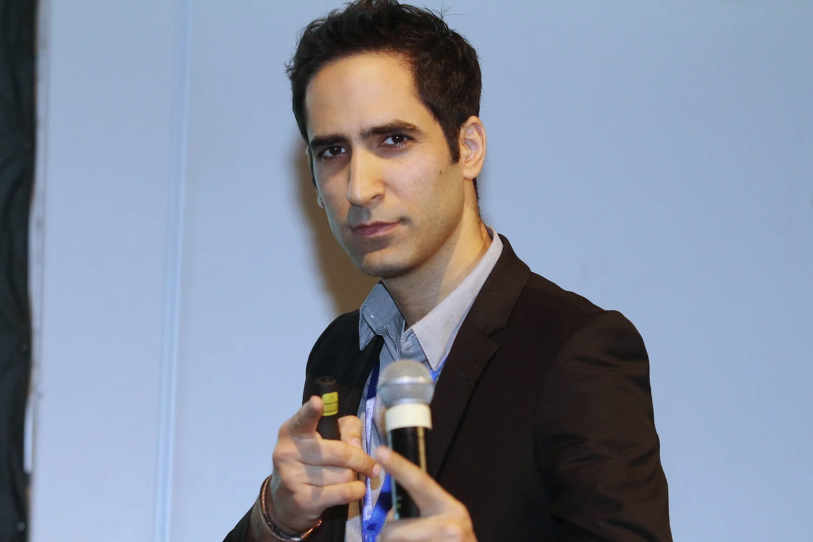 Menny Barzilay speaking with a microphone