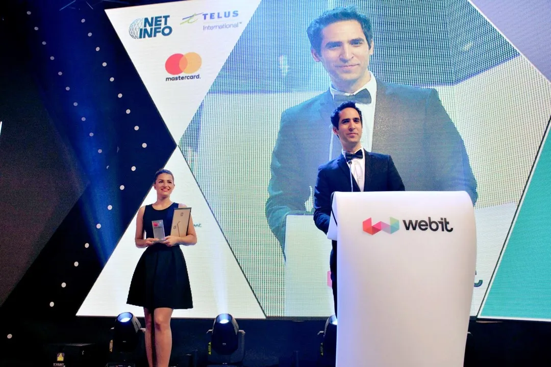 Menny Barzilay at the podium on the Webit stage